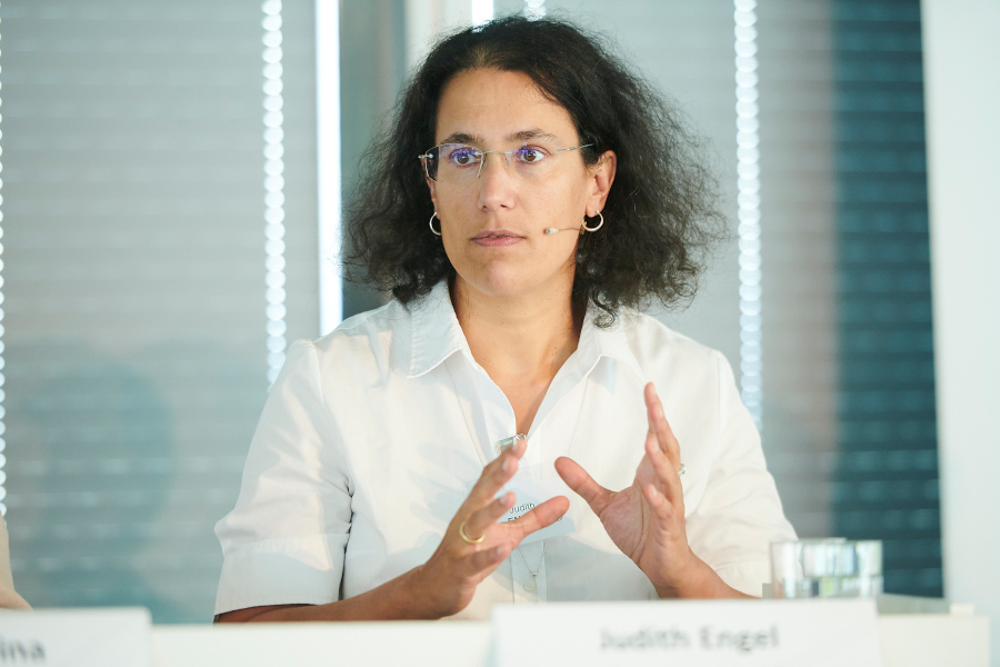 Close-up of Judith Engel as she is part of a panel discussion.