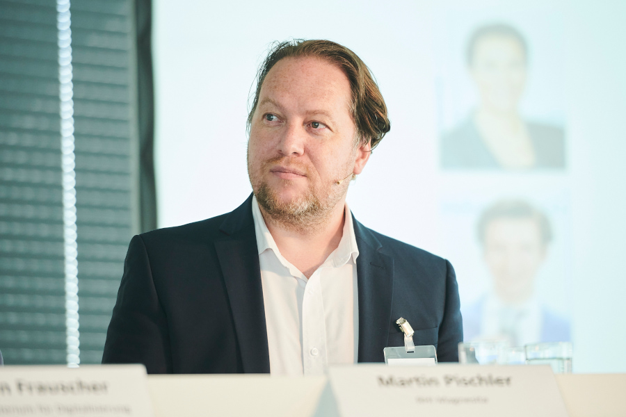 Martin Pischler sits on the panel of a panel discussion.