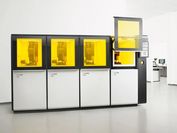 Image of a four-part 3D printing machine from the company Lithoz