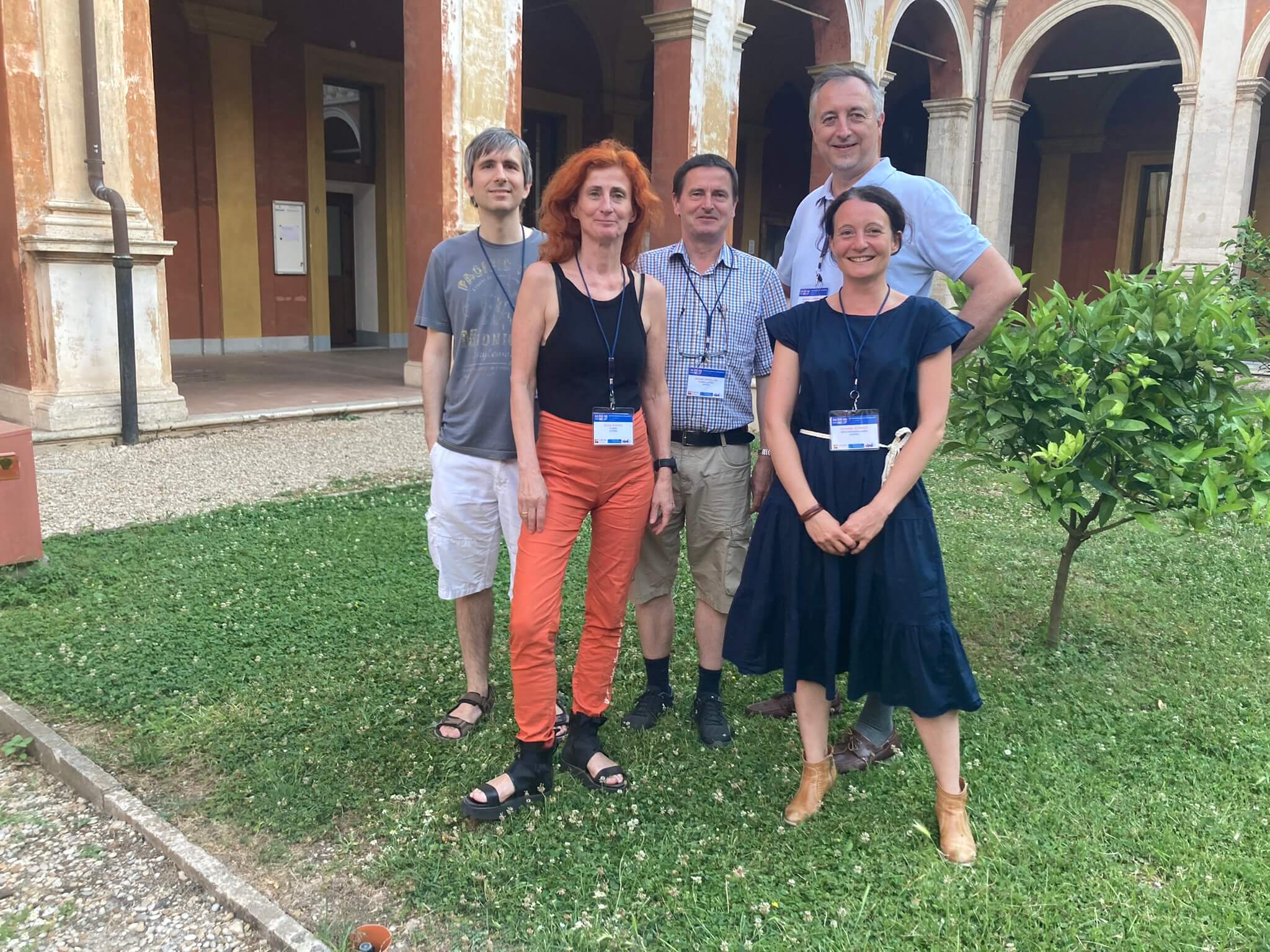 Group photo of VRVis researchers in a landscaped courtyard. 