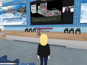 Screenshot from the virtual world Virbela: a blonde researcher stands in front of a stage. 
