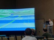 A man presents a journal paper at the scientific conference IEEE VIS 2022.