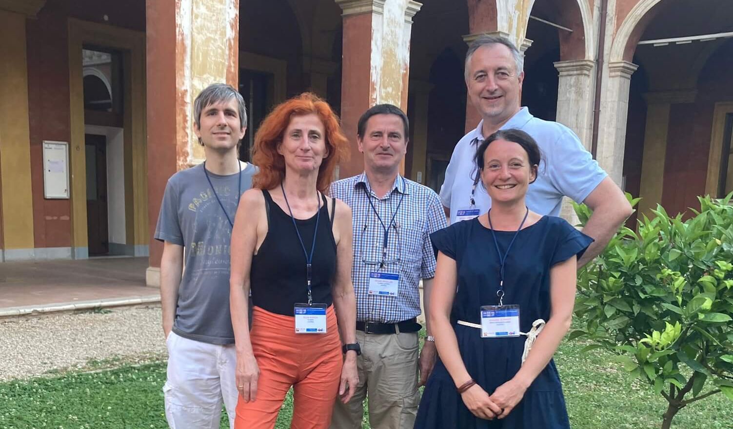 Group photo of VRVis researchers in a landscaped courtyard. 