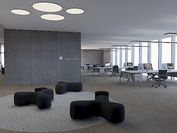 Büroraum, der mit einer Kombination aus Lichtdeisgn und natürlichem Licht ausgeleuchtet ist.